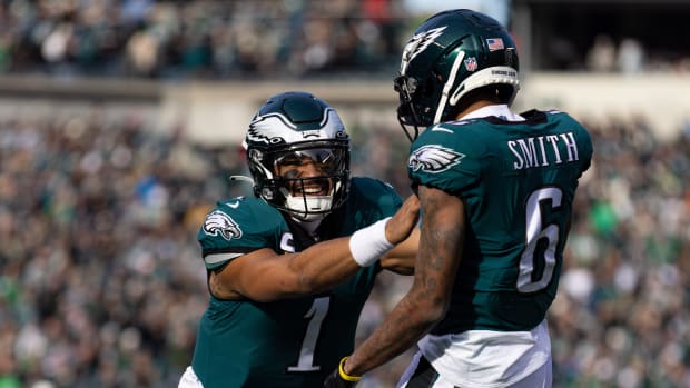 Dec 4, 2022; Philadelphia, Pennsylvania, USA; Philadelphia Eagles quarterback Jalen Hurts (1) and wide receiver DeVonta Smith (6) celebrate a touchdown connection against the Tennessee Titans during the first quarter at Lincoln Financial Field. Mandatory Credit: Bill Streicher-USA TODAY Sports